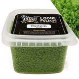 Container of loose foliage with a label on a white background