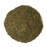 Round greenish-brown spice blend on a white background