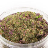 Moss mix in a clear container on a white background