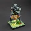 Decorative figurine on a stand with a green base