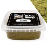 Container of static grass with a label on a white background