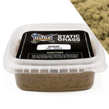Container of desert static grass with a label on a white background