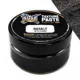 Black jar of texture paste with 'Huge Minis' branding on a white background