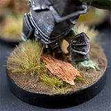 Miniature figure on a round base with grass and dirt