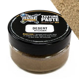 Jar of texture paste with black lid labeled 'Huge Minis' on a white background