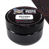 Black container of crackle paste with a cracked texture background