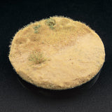 Round textured surface with grass-like growth on a black background