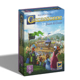 Board game box for 'Carcassonne' featuring a colorful illustration of a medieval festival.