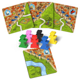 Board game components including cards and colorful player pieces on a white background