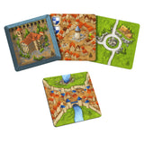 Set of board game cards with village and castle illustrations on a white background