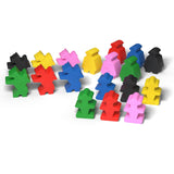 Colorful plastic game pieces on a white background