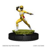Yellow Power Ranger figure on a green platform with black base against a white background