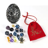 Collection of dice and dice storage bag on a white background