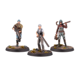Three miniature figures on round bases with a white background