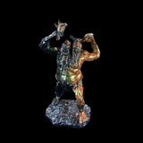 Metallic figurine of a warrior on a black background