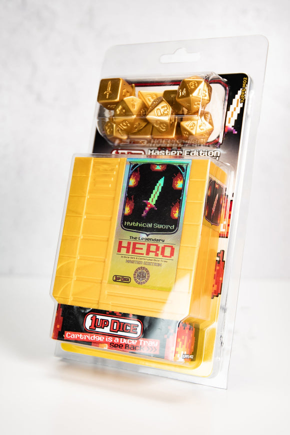 Packaged dice set with gold dice and colorful box on a white background