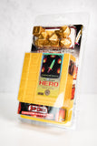 Packaged dice set with gold dice and colorful box on a white background