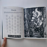 Open book with oracle rules and black and white illustration on a white background