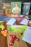 Board game components including cards and dice on a wooden surface
