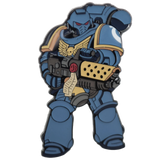 Metallic blue and gold robot character holding a weapon on a white background