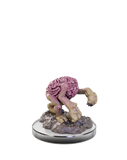 Figurine with a pink brain and clawed feet on a white background