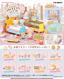 Collection of small toy figures and furniture pieces in a pastel-themed room setting.
