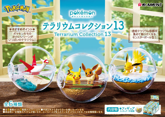 Pokémon Terrarium Collection 13 with three small glass terrariums on a wooden surface.