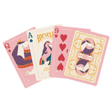 Four playing cards with unicorn designs on a white background