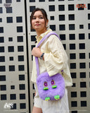 Person holding a purple plush bag with a checkered background