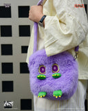 Purple plush bag with cartoonish face held by a person against a checkered background