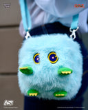 Blue plush bag with cartoonish face design on a strap