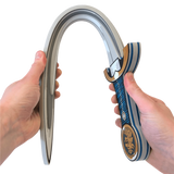 Carabiner with a decorative design held by two hands on a white background