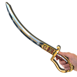 Decorative sword held by a hand on a white background