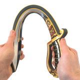 Person holding a decorative bow with intricate designs on a white background