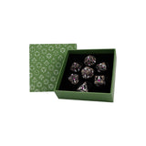 Set of dice in a green box with geometric pattern