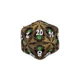 D20 polyhedral dice with gold and black texture and green numbers on a white background