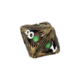 Decorative die with intricate design and green and white numbers on a white background