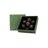 Set of dice with camouflage pattern in a green box with die patterns.