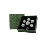 Set of decorative silver and blue crystal items in a green box with geometric pattern.