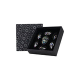 Set of crystal figurines in a black box with geometric patterned lid on a white background