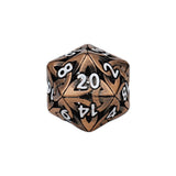 Metal polyhedral dice with bronze and black numbers on a white background