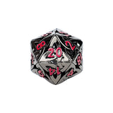 Black polyhedral dice with red numbers on a white background