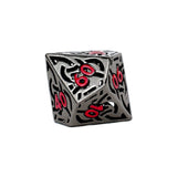 Decorative dice with black and red design on a white background