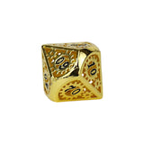 Gold polyhedral dice on a white background