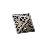 Metal polyhedral dice with intricate design and gold symbols on a white background