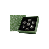 Set of silver dice in a green box with dice pattern