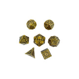 Set of gold and black polyhedral dice on a white background