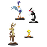 Four animated character figurines on a white background