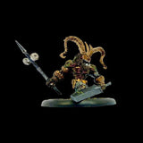 Miniature figurine with a weapon on a black background