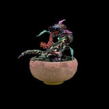 Decorative sculpture in a bowl on a black background